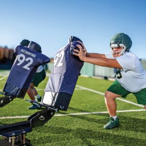 Rae Crowther BUCKEE SLED offensive line tool featuring rotating H1 pads with jerseys to practice playing long, square, and achieving shoulder disruption.